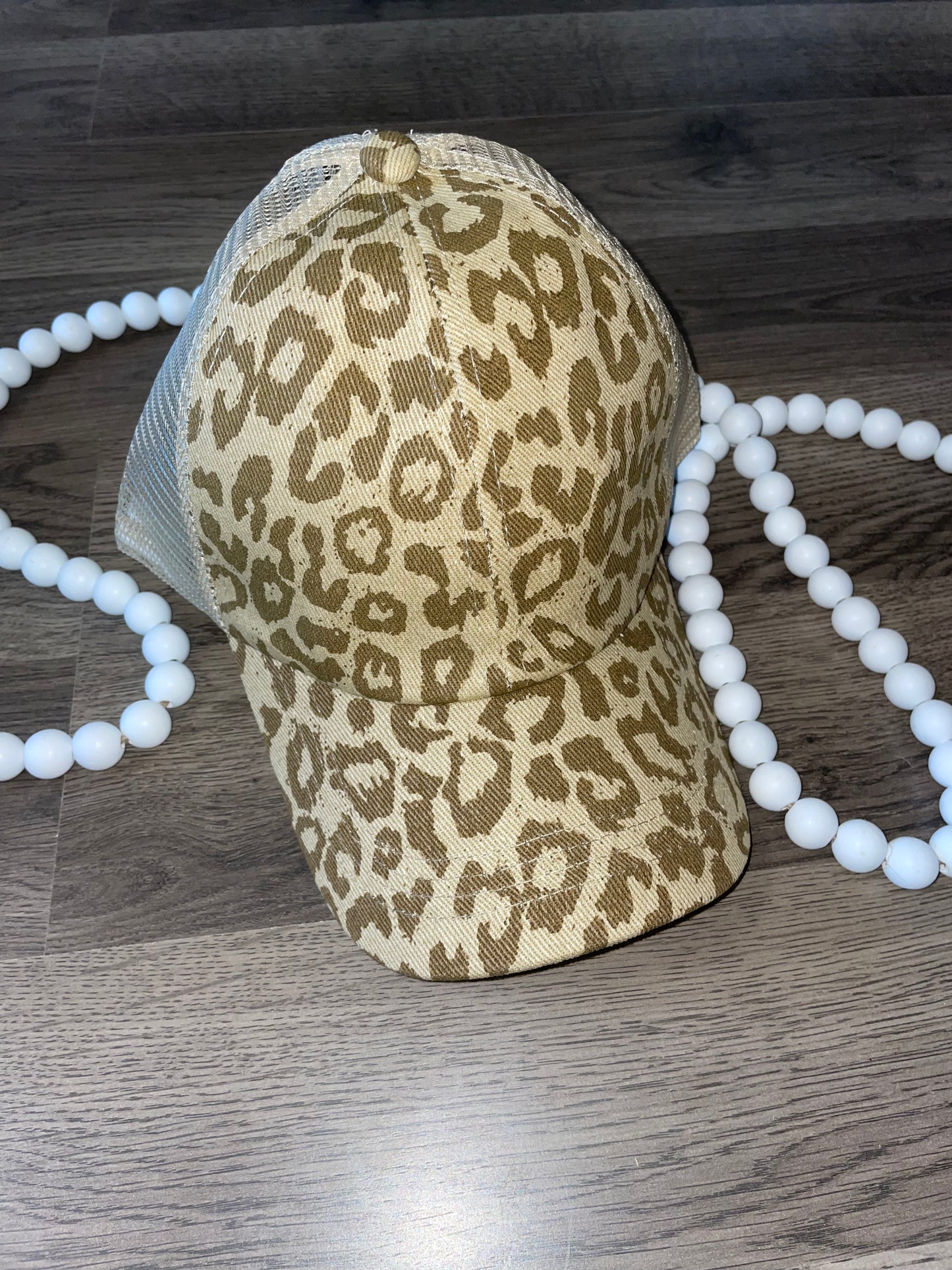 Monotone tan leopard criss cross hat